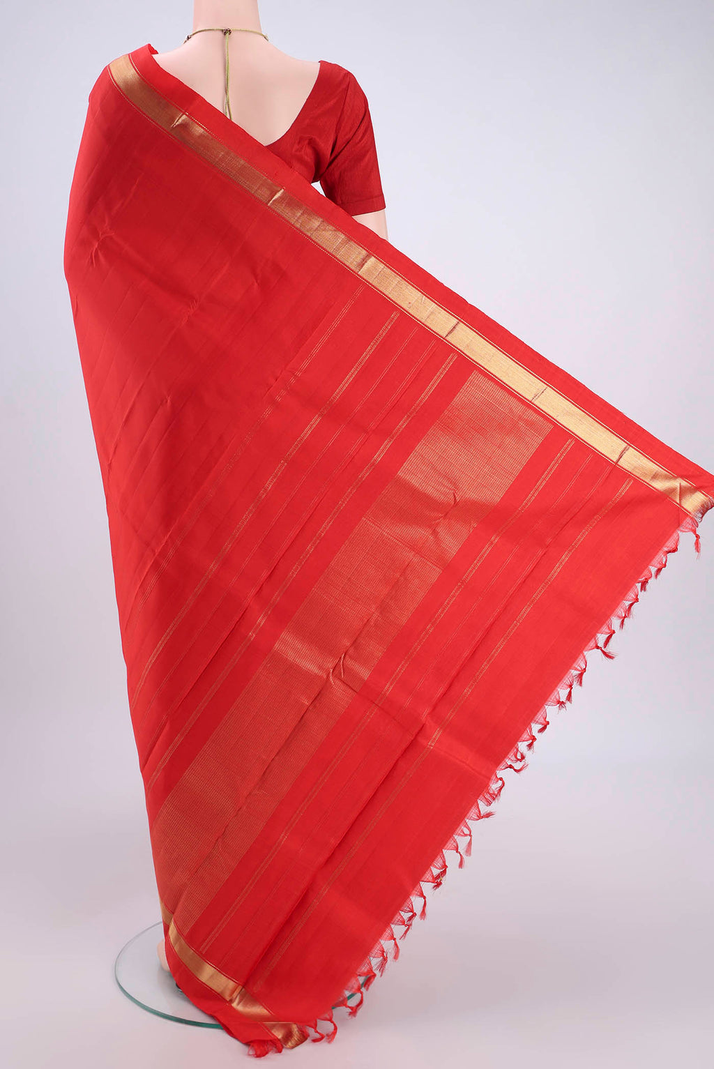 Flat view of Orange Kanjivaram Silk Saree with Zari Butta on the body and One Side Border. 