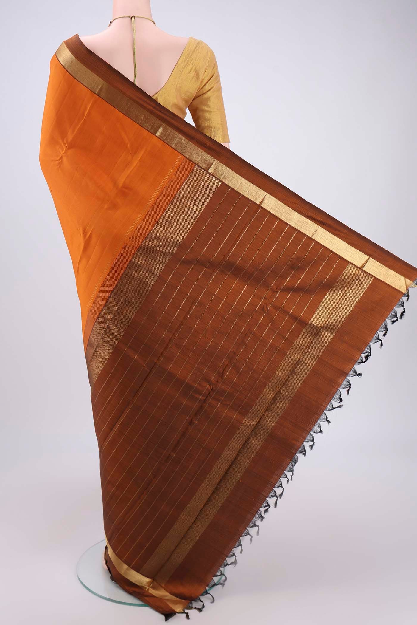 Flat view of Mustard Dual Tone Kanjivaram Silk Saree with Plain Body and Zari Border. 