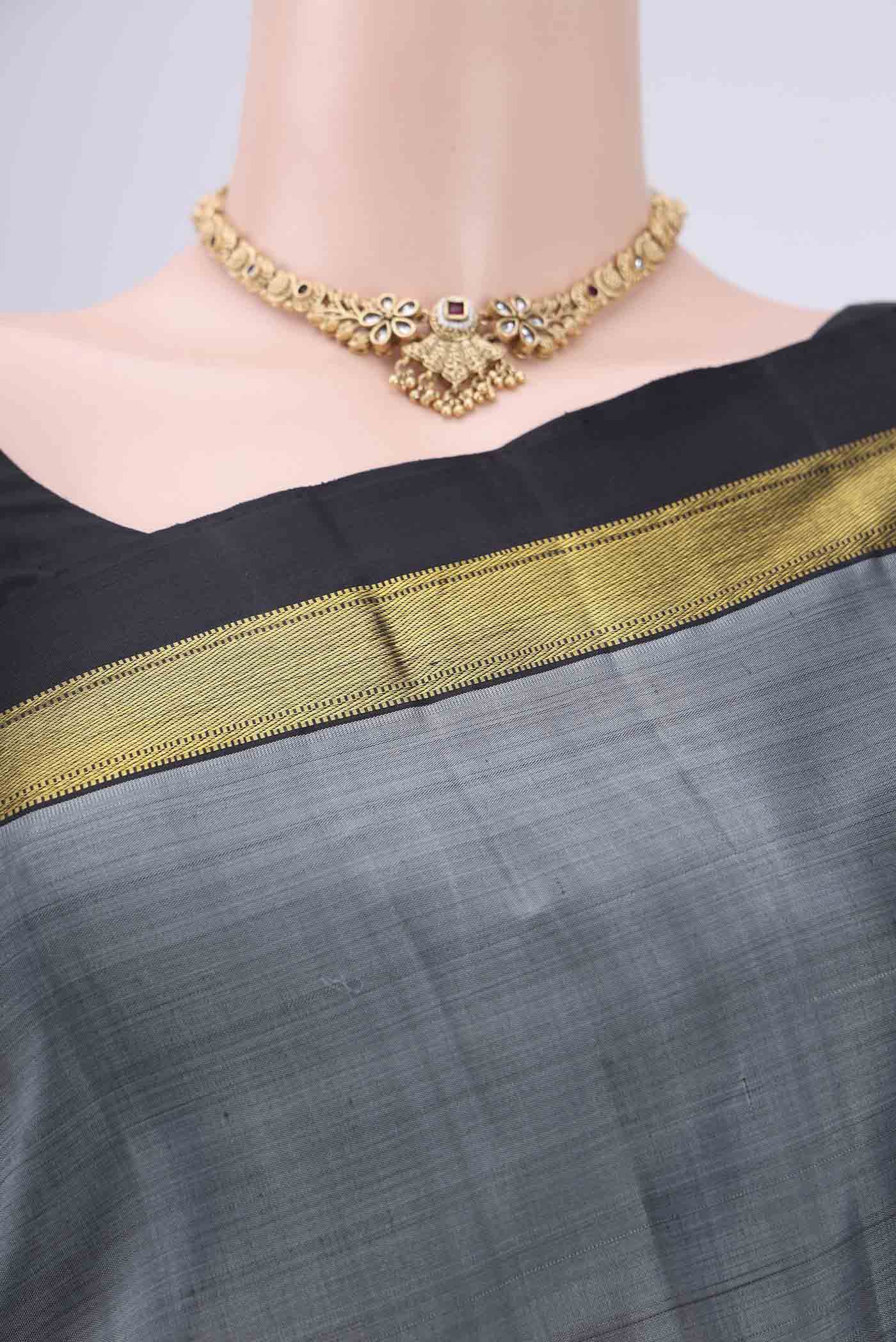Border image of Grey Kanjivaram Silk Saree with Plain Body and Zari Border. 