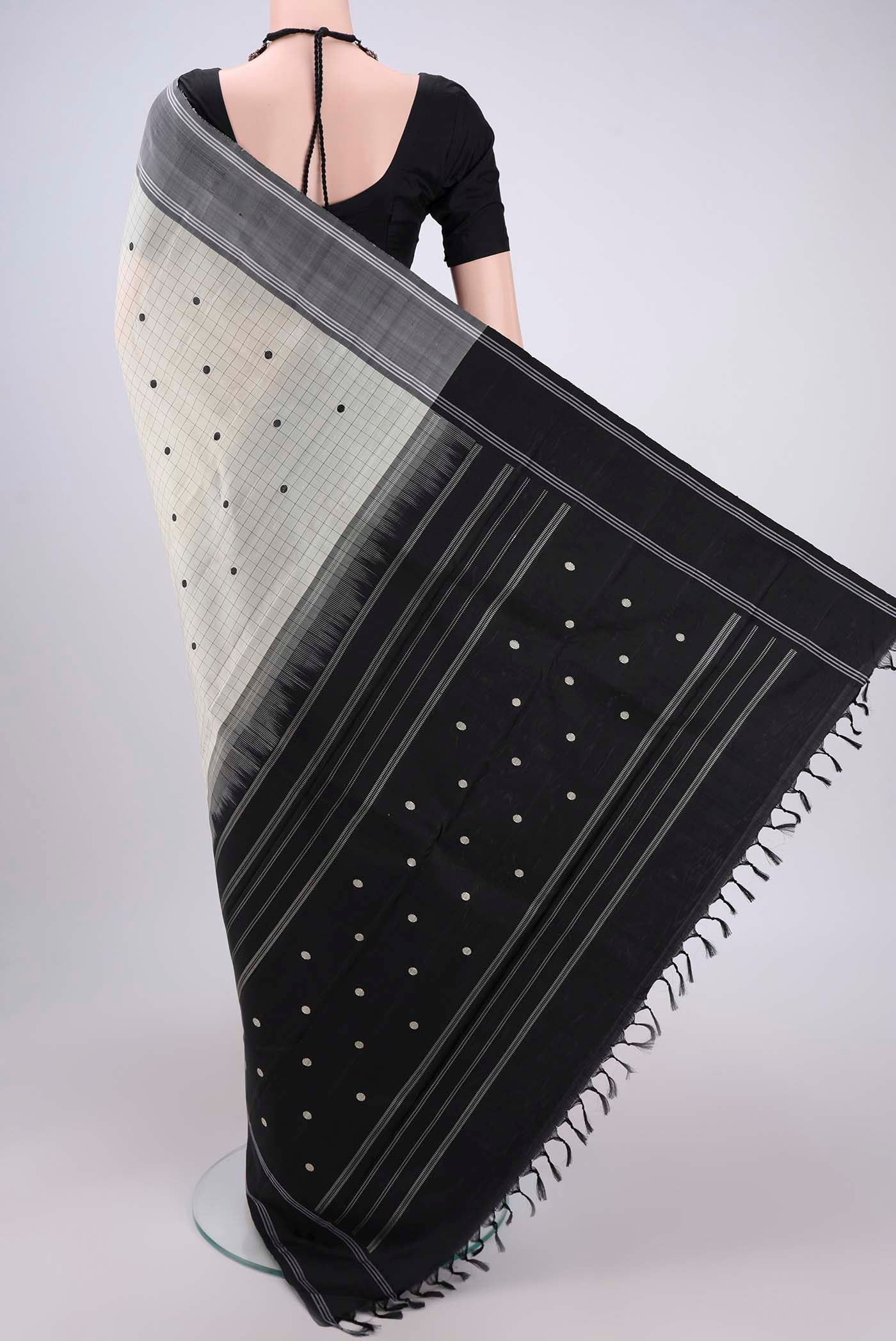 Flat view of Off White Kanjivaram Saree with Checked design on the body and Plain Border. 