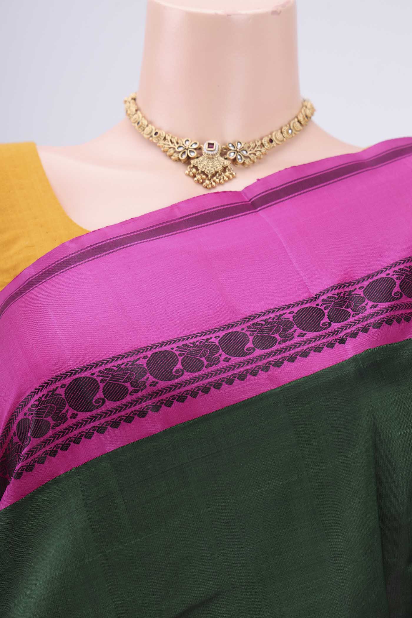 Border image of Bottle Green Kanjivaram Silk Saree with Plain Body and Ganga Jamuna Border. 