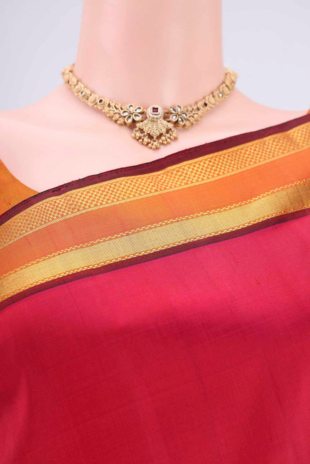 Border image of Rani Pink Kanjivaram Silk Saree with Plain Body and Zari Border. 