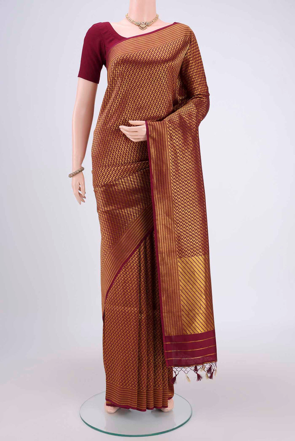 Magenta Banarasi Saree with Zari Brocade on the body and Thread Border.  displayed on a mannequin