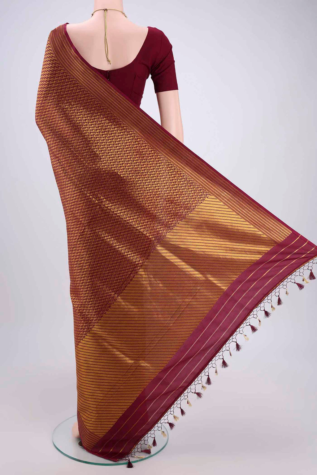 Flat view of Magenta Banarasi Saree with Zari Brocade on the body and Thread Border. 