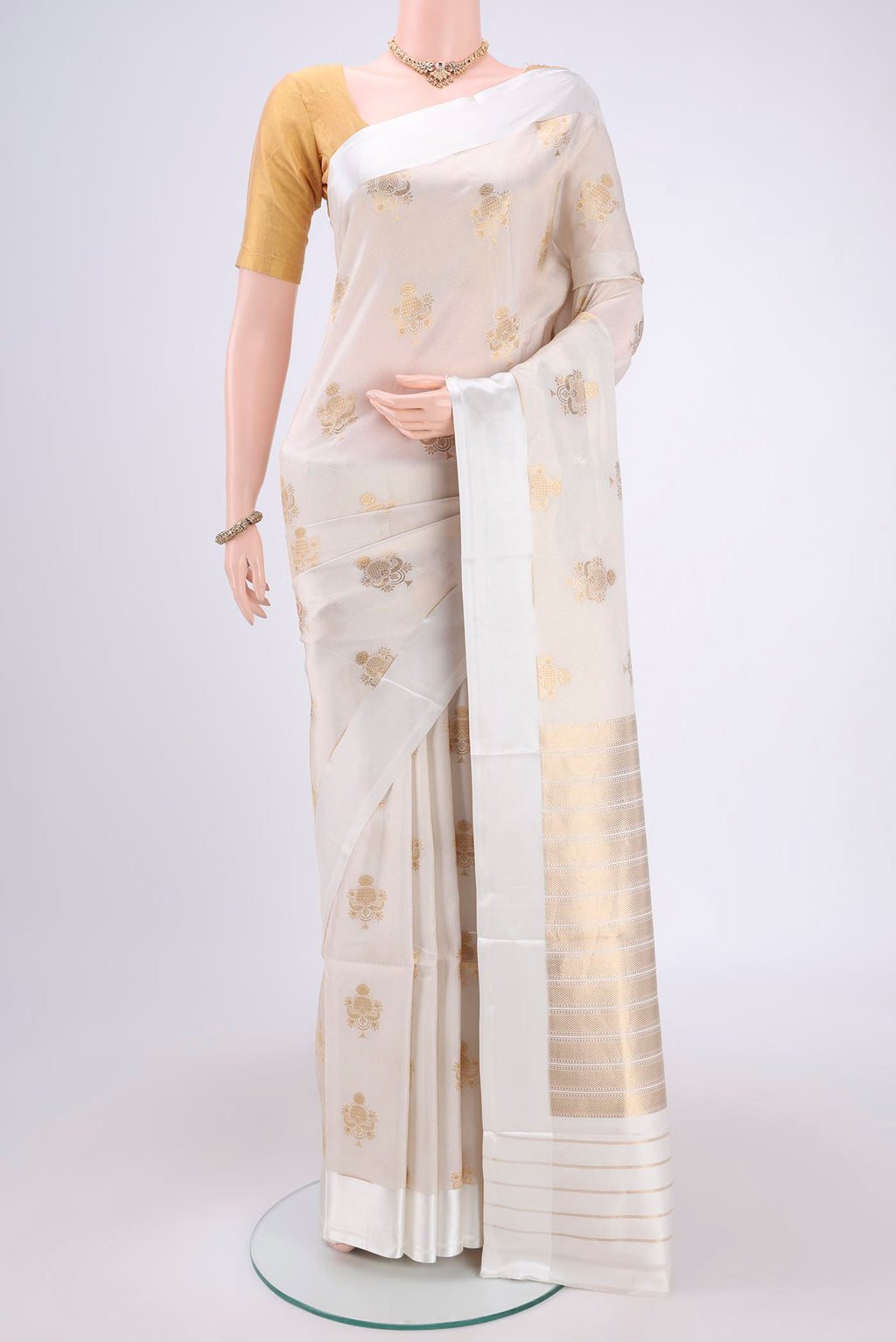 Off White Banarasi Saree with Zari Brocade on the body and Plain Border.  displayed on a mannequin