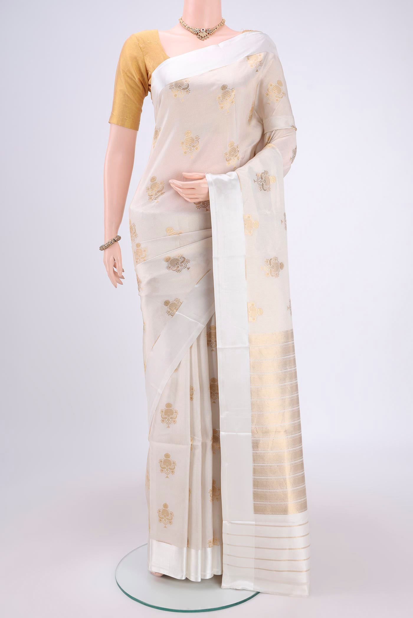 Off White Banarasi Saree with Zari Brocade on the body and Plain Border.  displayed on a mannequin