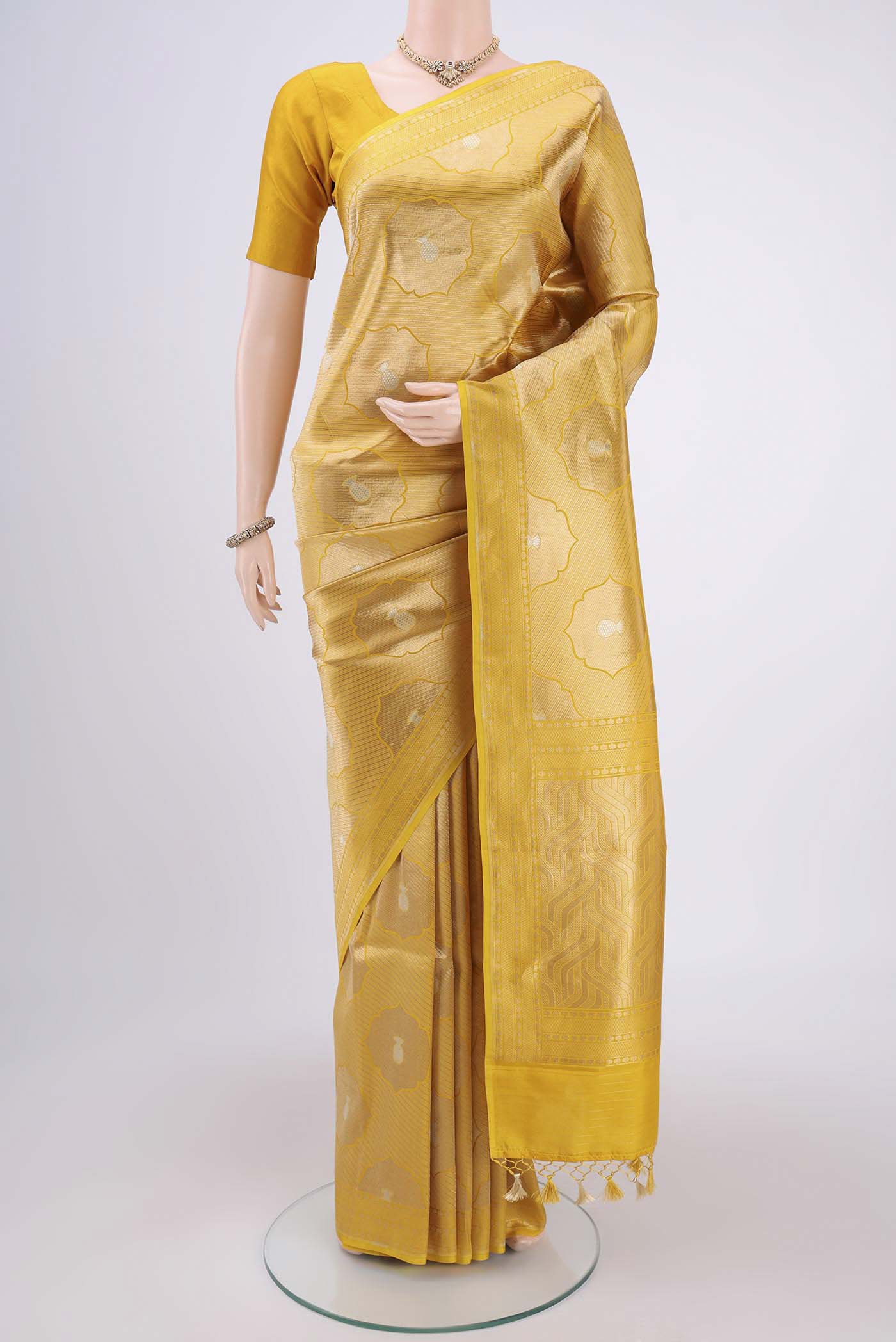 Yellow Banarasi Saree with Zari Brocade on the body and Thread Border.  displayed on a mannequin
