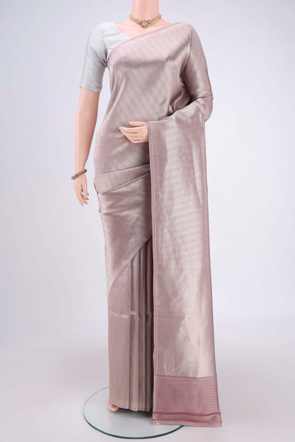 Mauve Banarasi Saree with Zari Brocade on the body and Thread Border.  displayed on a mannequin