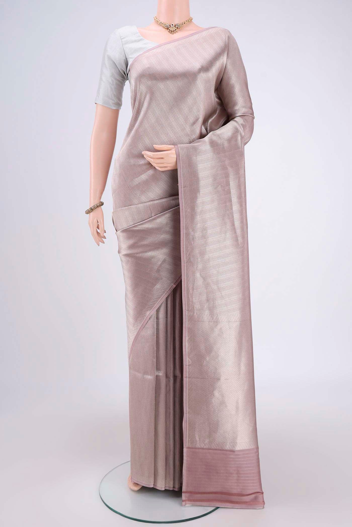 Mauve Banarasi Saree with Zari Brocade on the body and Thread Border.  displayed on a mannequin