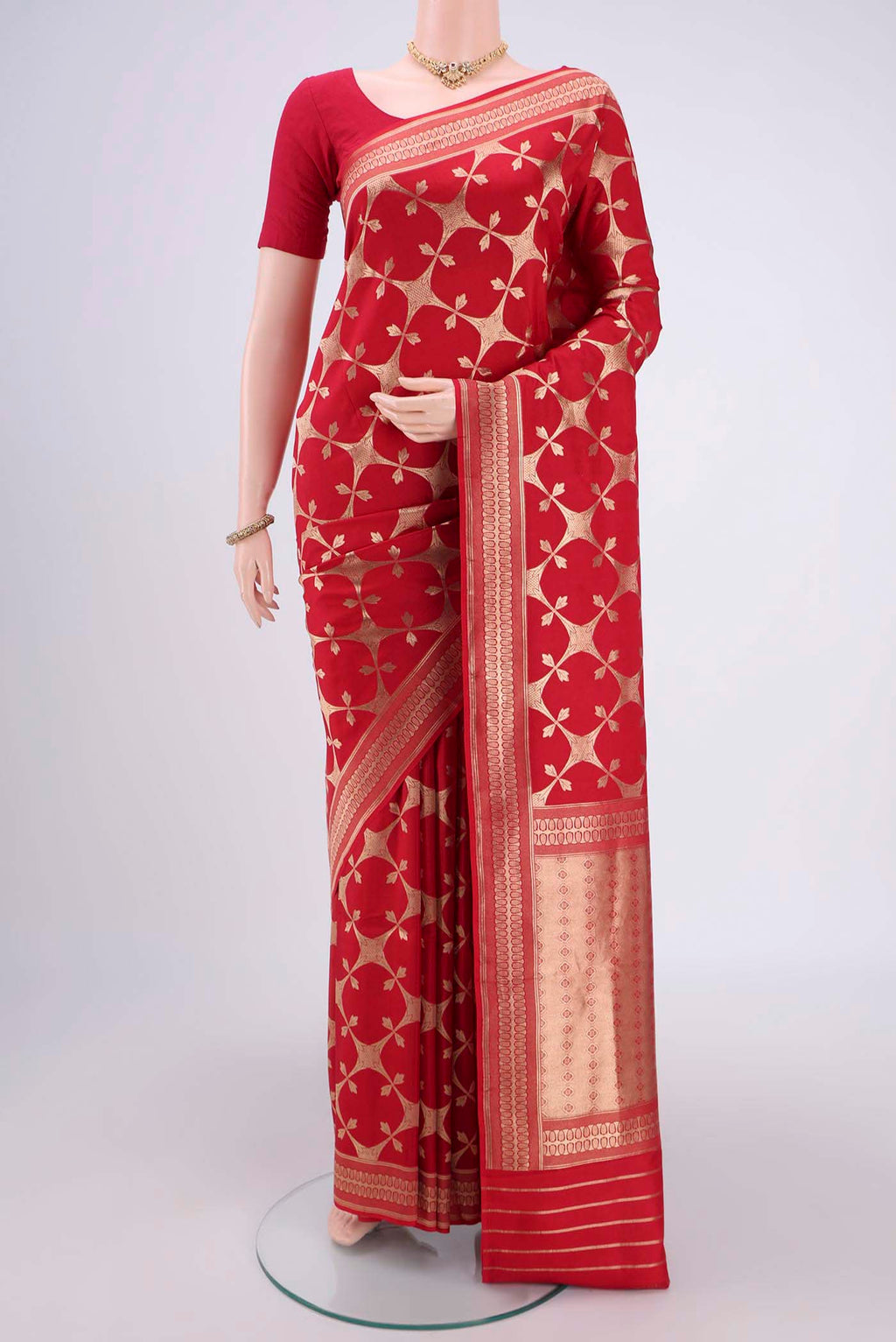 Red Banarasi Saree with Zari Brocade on the body and Thread Border.  displayed on a mannequin