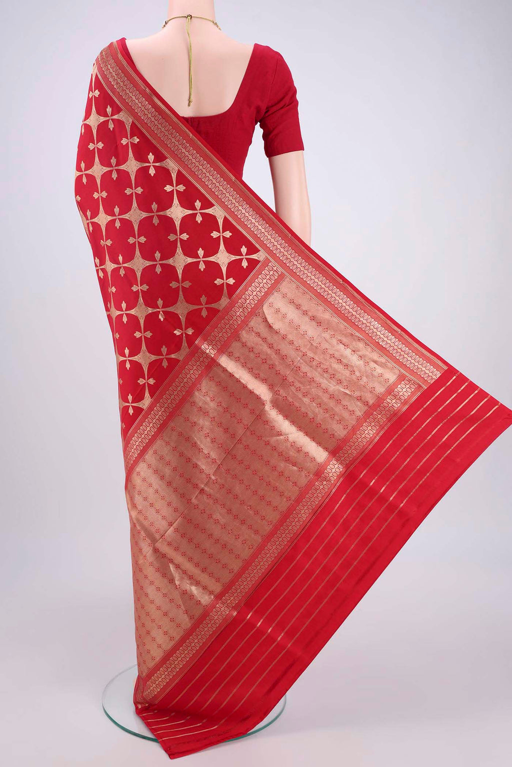 Flat view of Red Banarasi Saree with Zari Brocade on the body and Thread Border. 