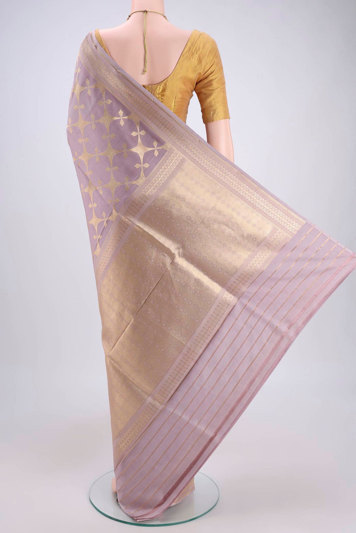 Flat view of Mauve Banarasi Saree with Zari Brocade on the body and Thread Border. 