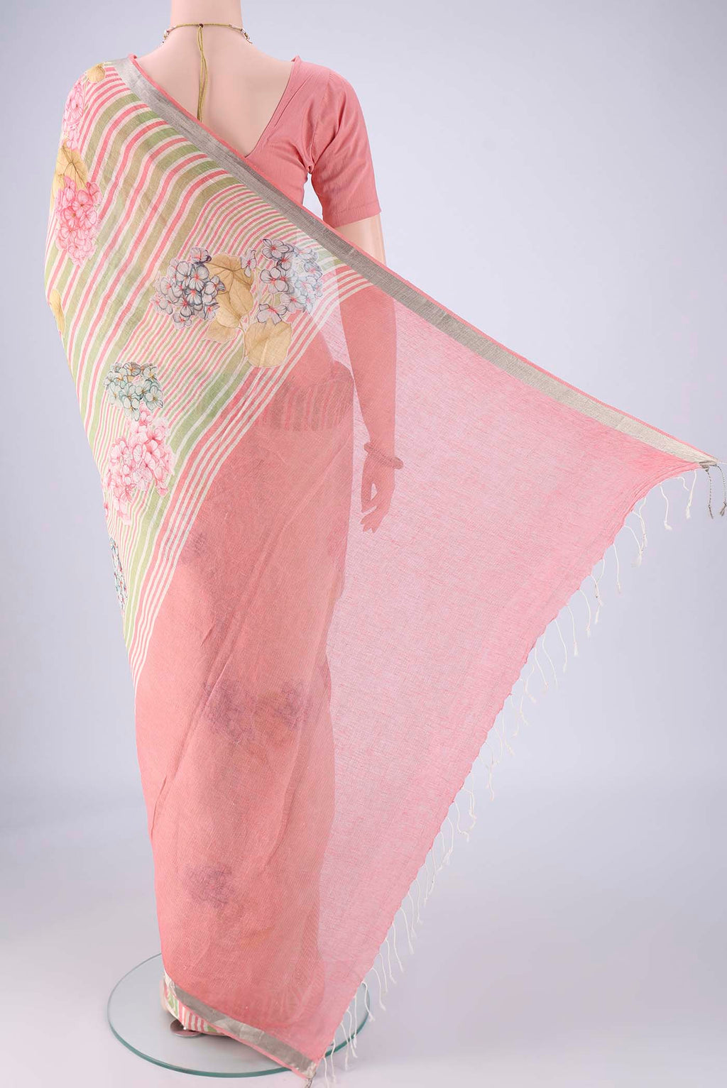 Flat view of Off White Linen Saree with Floral Print on the body and Zari Border. 