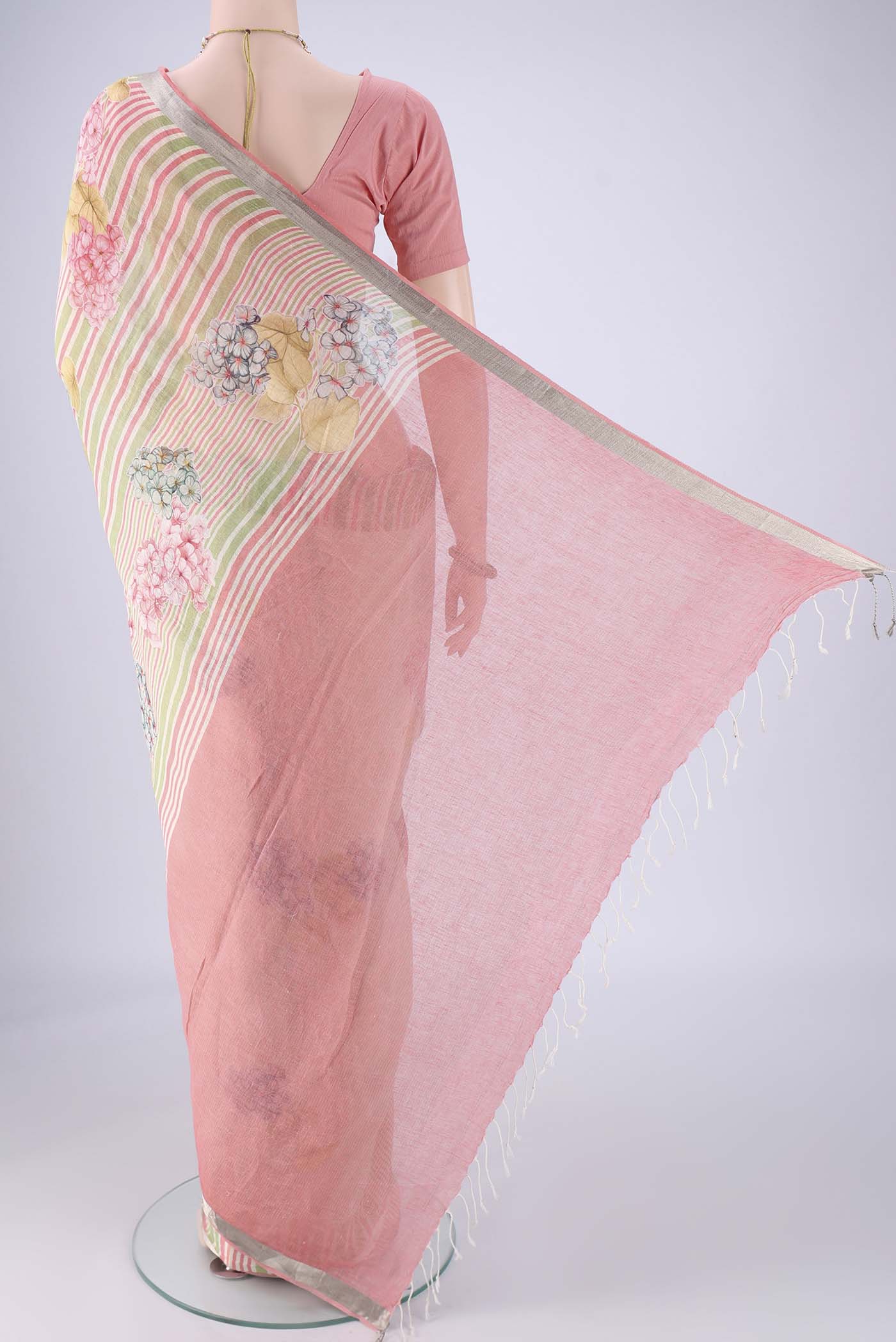 Flat view of Off White Linen Saree with Floral Print on the body and Zari Border. 