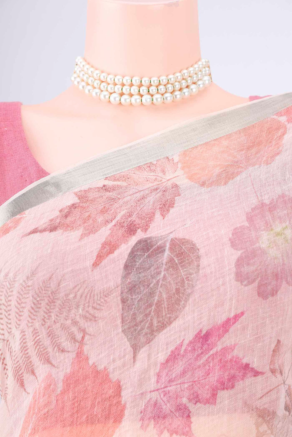 Border image of Rose Gold Linen Saree with Printed design on the body and Zari Border. 