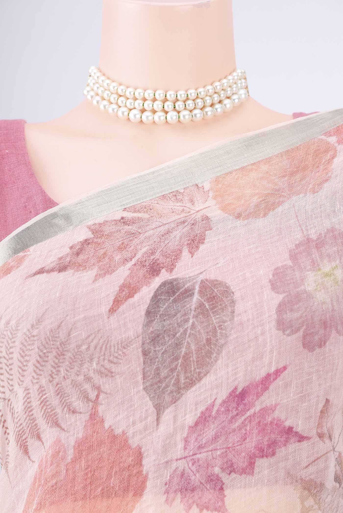 Border image of Rose Gold Linen Saree with Printed design on the body and Zari Border. 