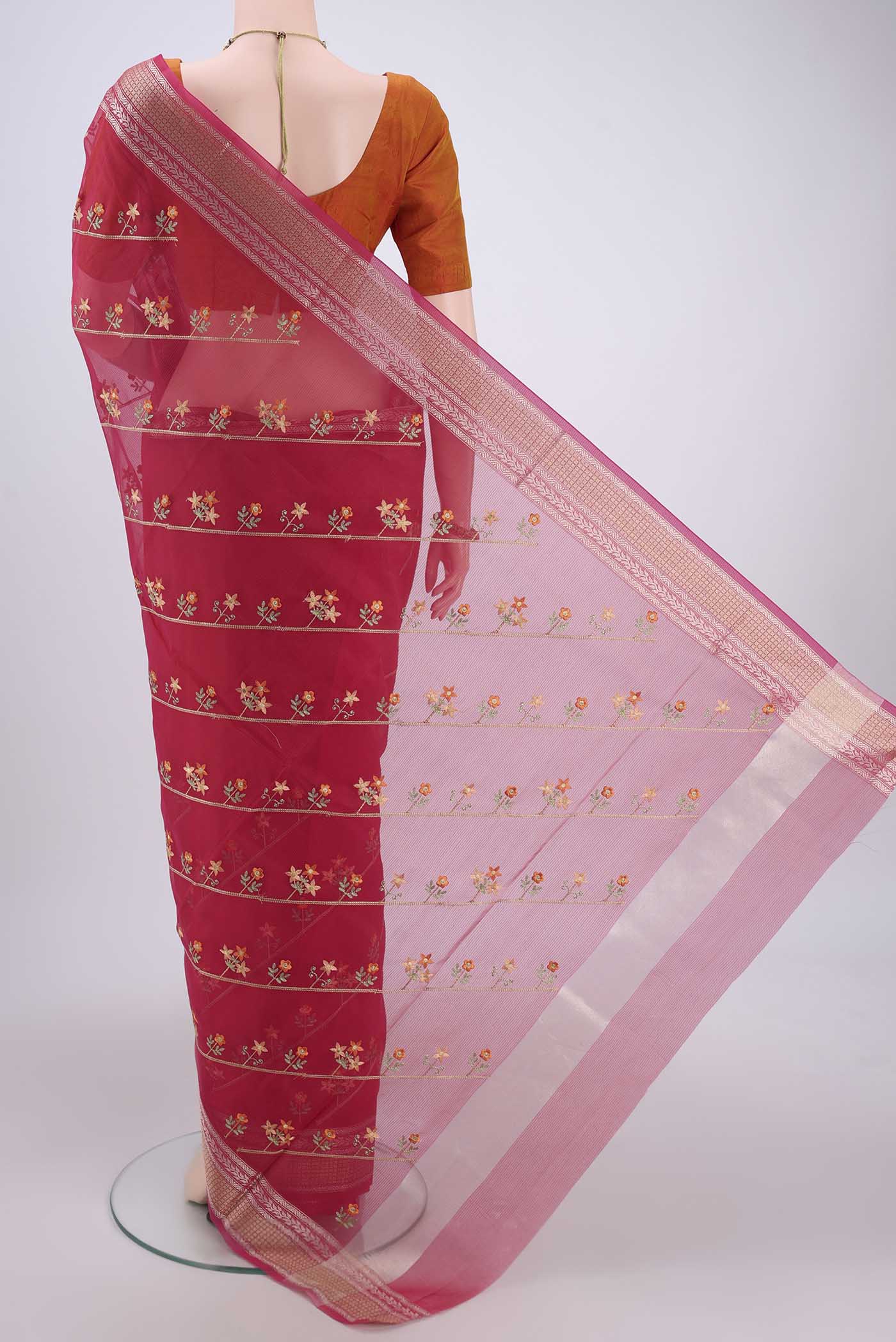 Flat view of Dark Pink Kota Cotton Saree with Embroidery on the body and Zari Border. 