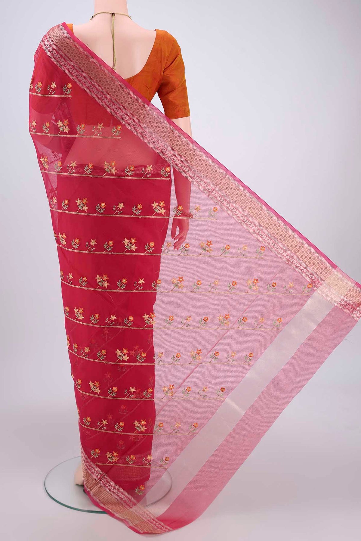Flat view of Dark Pink Kota Cotton Saree with Embroidery on the body and Zari Border. 