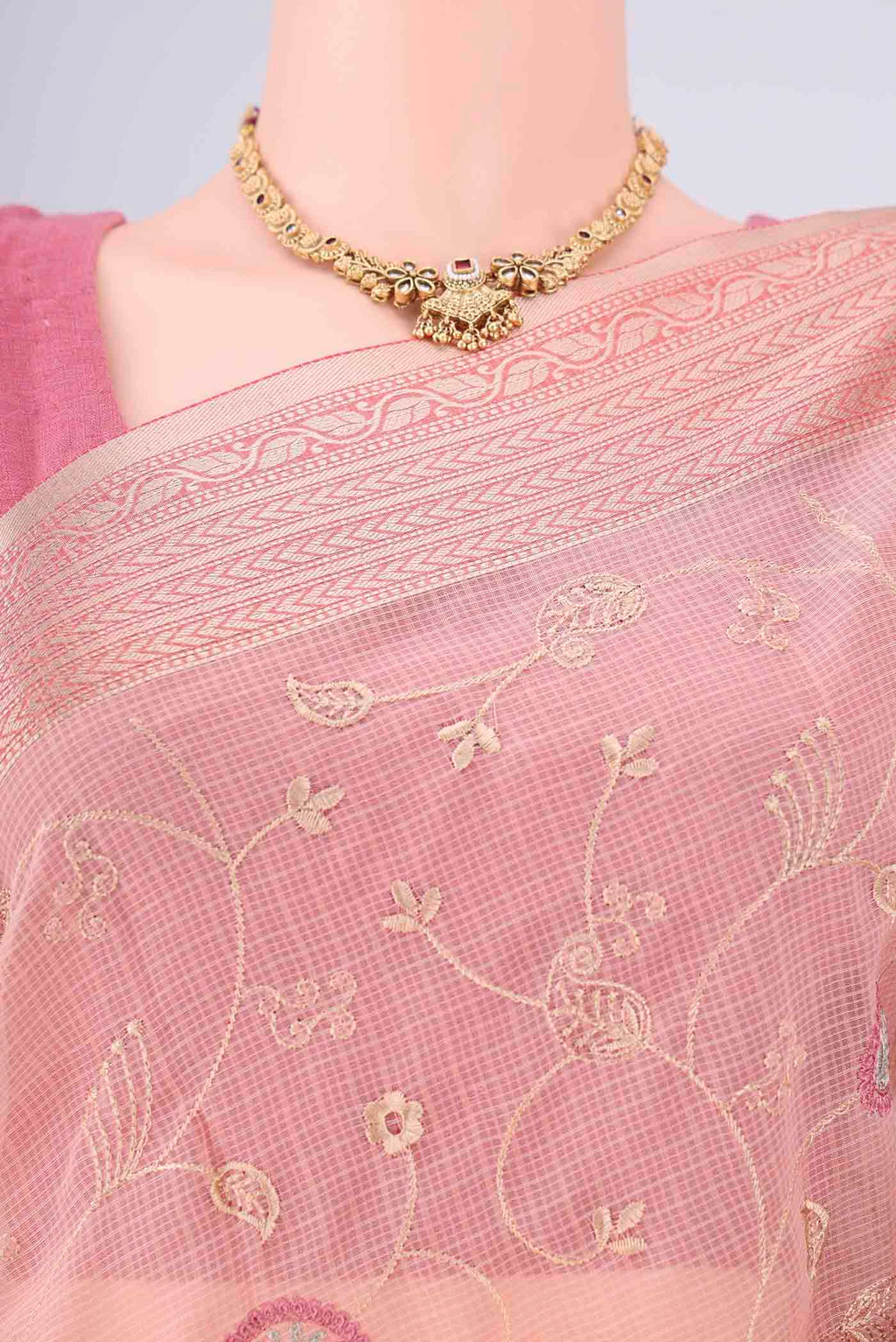 Border image of Peach Blended Kota Cotton Saree with Embroidery on the body and Zari Border. 