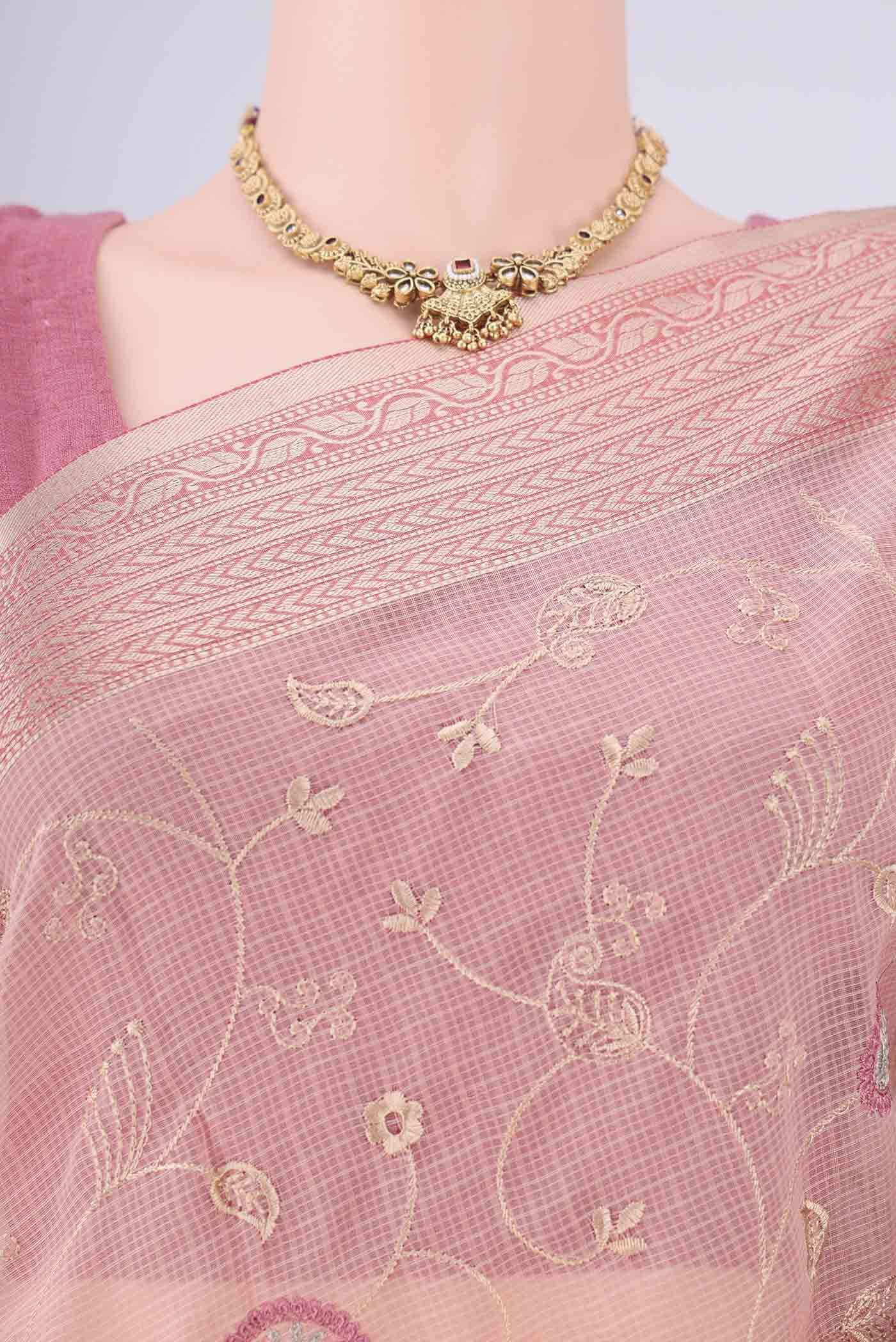 Border image of Peach Blended Kota Cotton Saree with Embroidery on the body and Zari Border. 