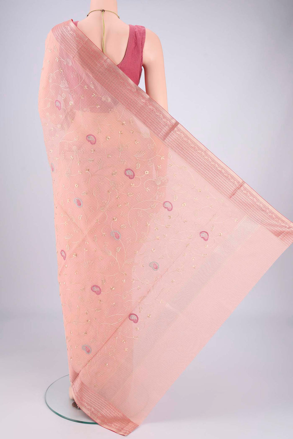 Flat view of Peach Blended Kota Cotton Saree with Embroidery on the body and Zari Border. 