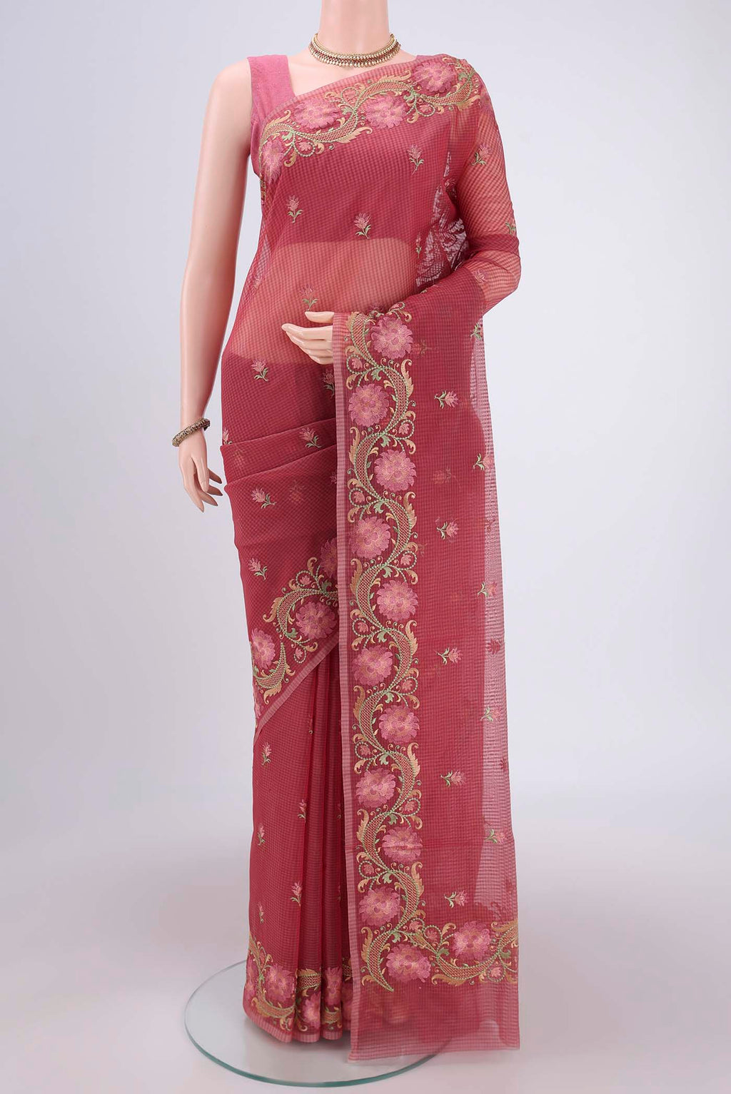 Coral Kota Cotton Saree with Embroidery on the body and Thread Border.  displayed on a mannequin