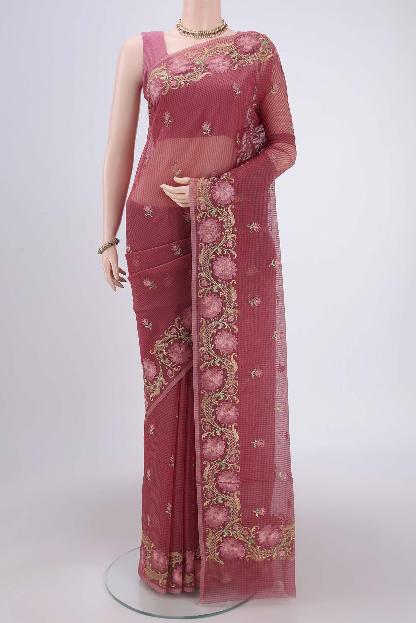 Coral Kota Cotton Saree with Embroidery on the body and Thread Border.  displayed on a mannequin