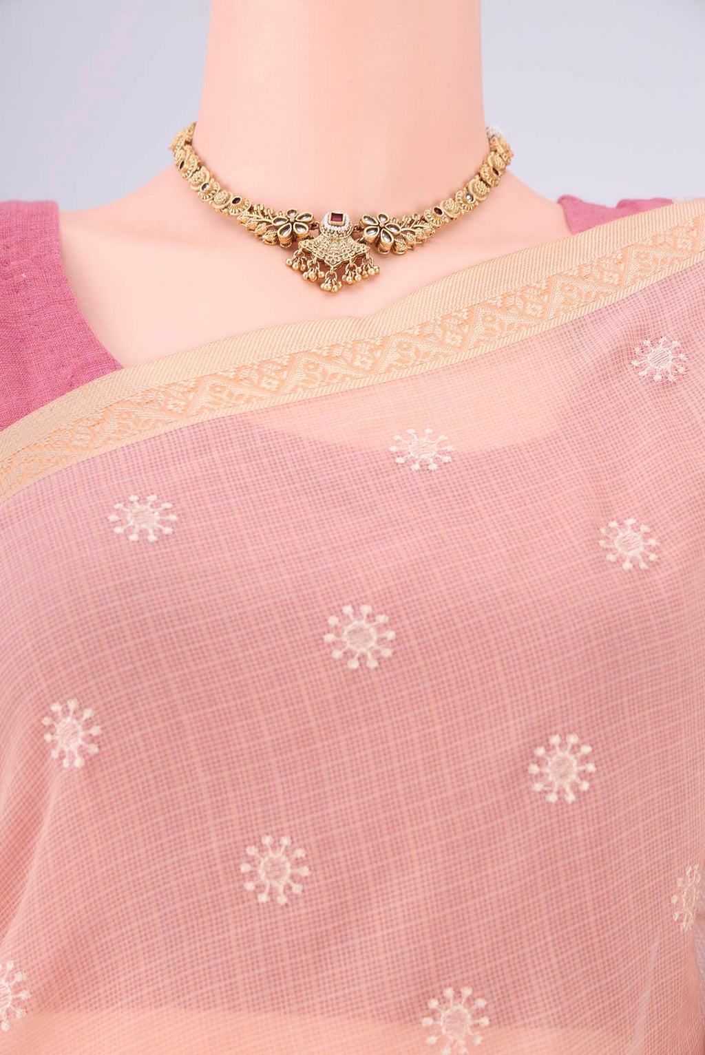 Border image of Peach Blended Kota Cotton Saree with Embroidery on the body and Thread Border. 