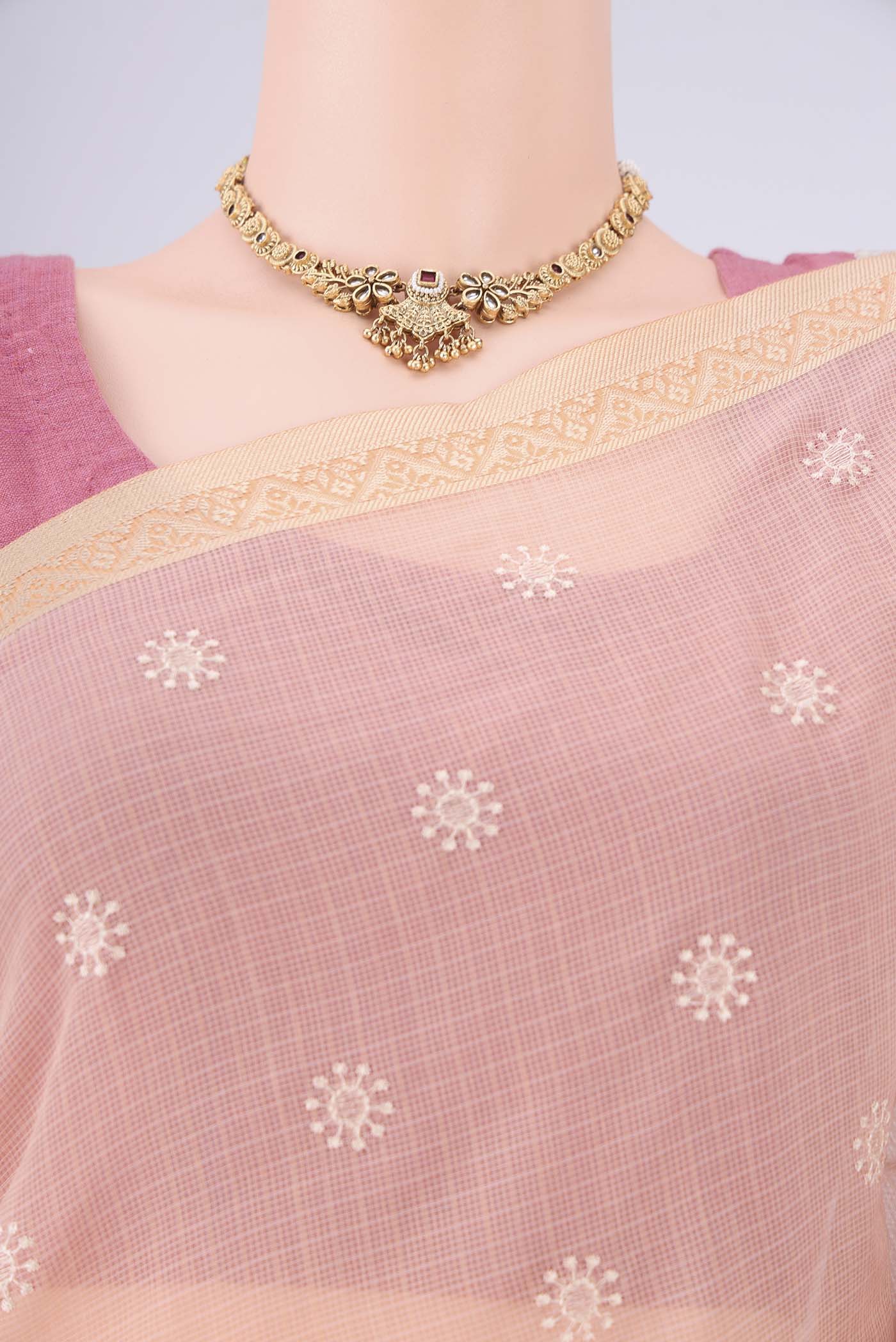 Border image of Peach Blended Kota Cotton Saree with Embroidery on the body and Thread Border. 
