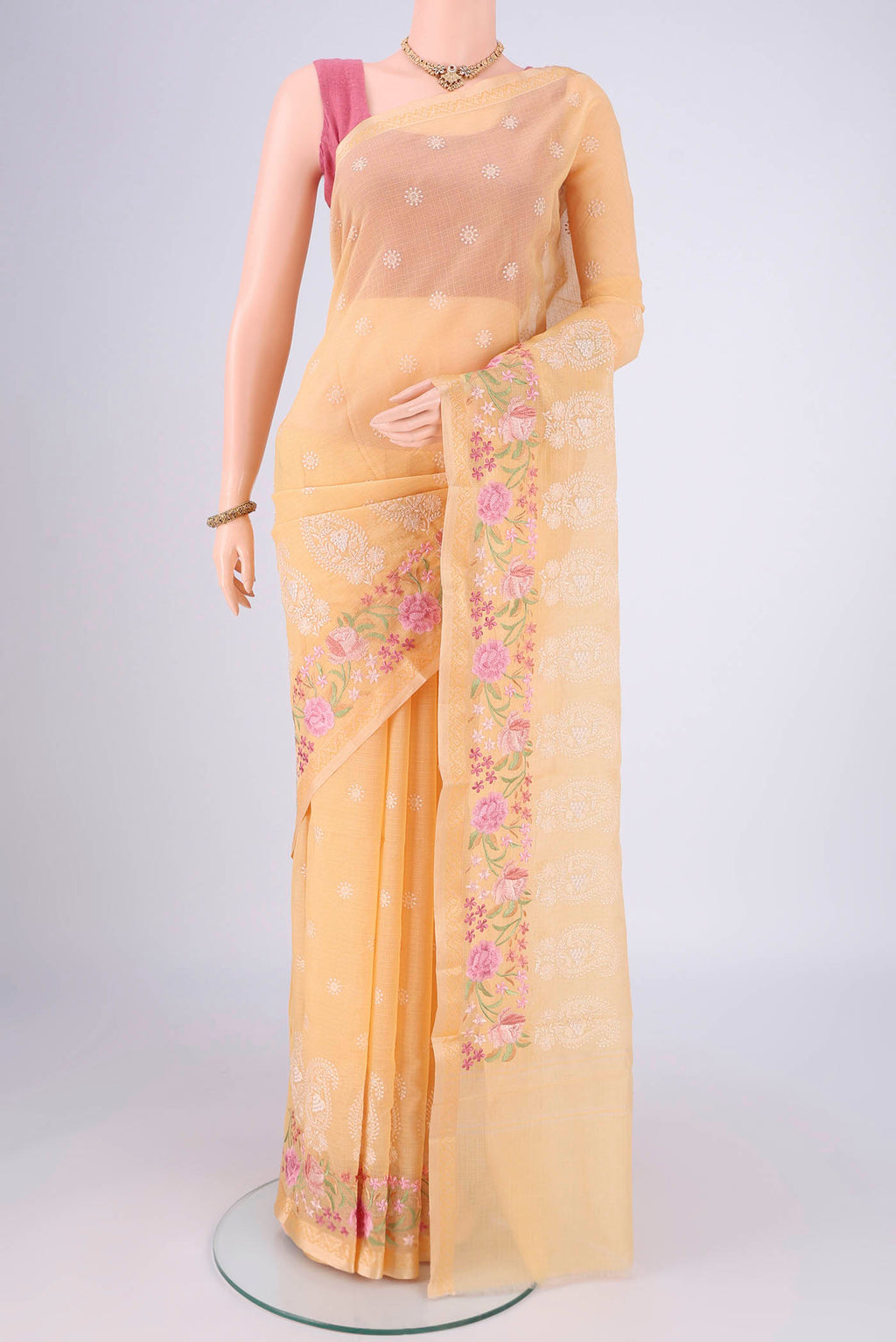 Sandal Blended Kota Cotton Saree with Embroidery on the body and Thread Border.  displayed on a mannequin