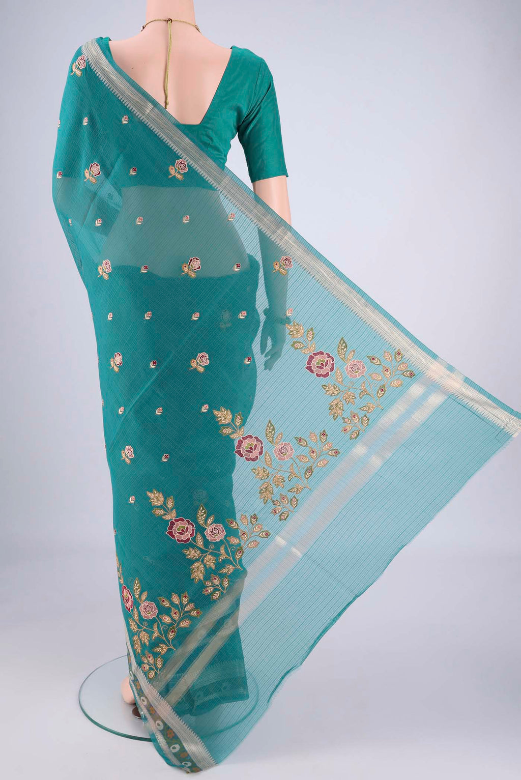 Flat view of Sea Green Blended Kota Cotton Saree with Embroidery on the body and Zari Border. 