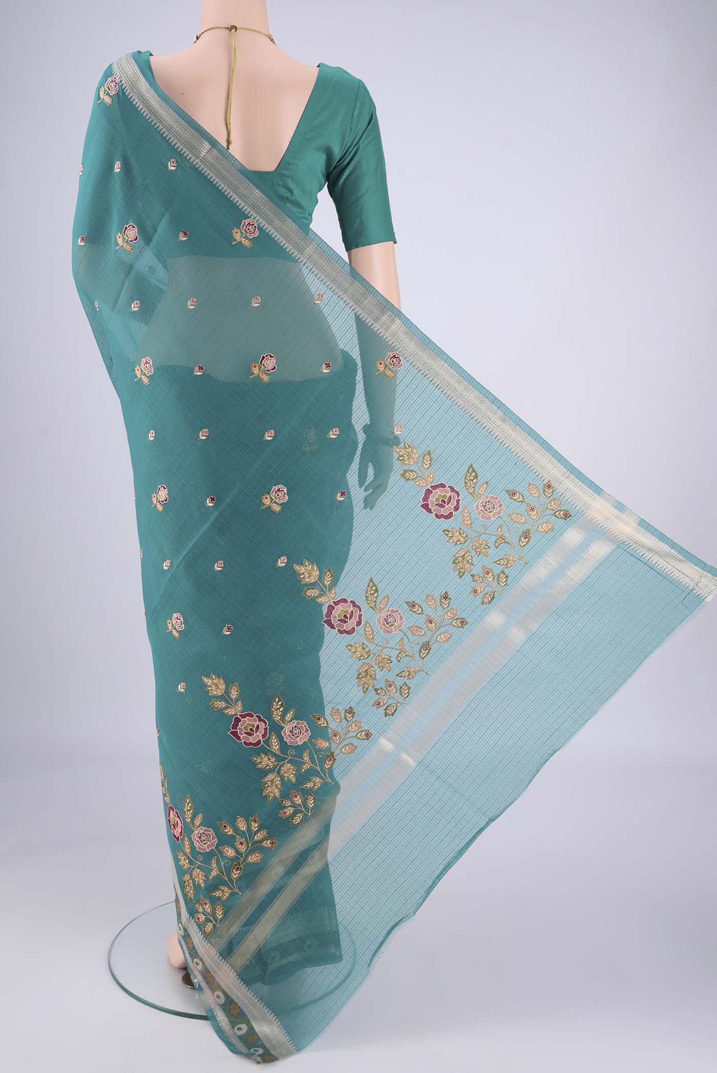 Flat view of Sea Green Blended Kota Cotton Saree with Embroidery on the body and Zari Border. 