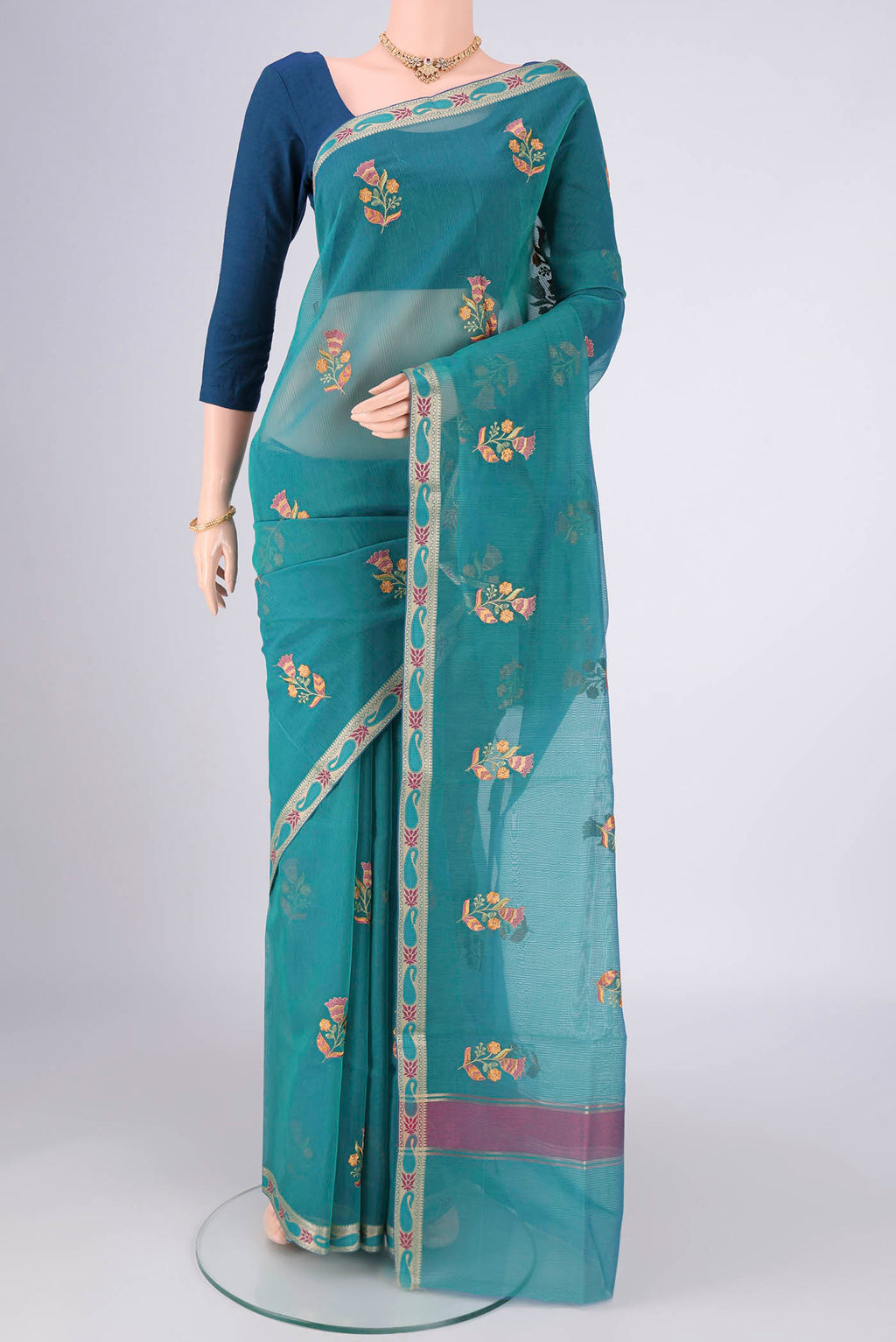 Peacock Blue Dual Tone Blended Kota Cotton Saree with Embroidery on the body and Zari And Thread Border.  displayed on a mannequin