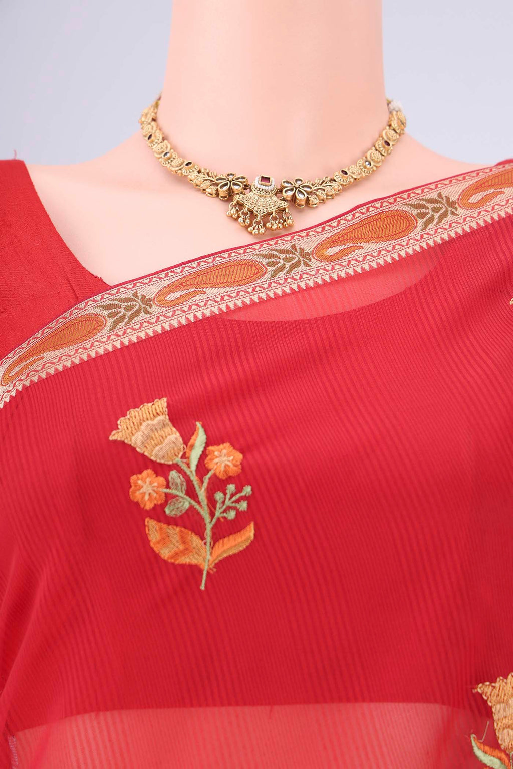 Border image of Red Blended Kota Cotton Saree with Embroidery on the body and Zari And Thread Border. 