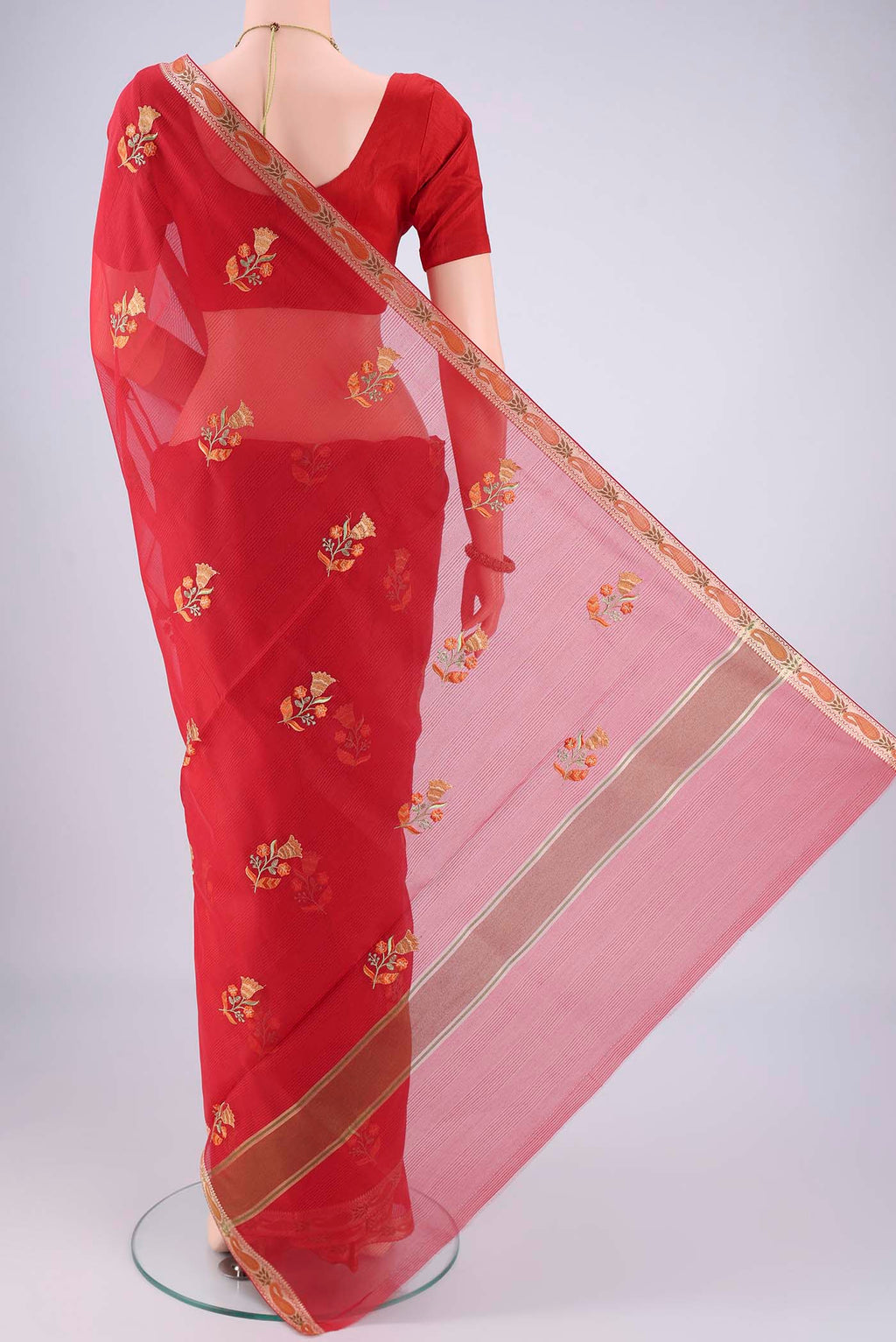Flat view of Red Blended Kota Cotton Saree with Embroidery on the body and Zari And Thread Border. 