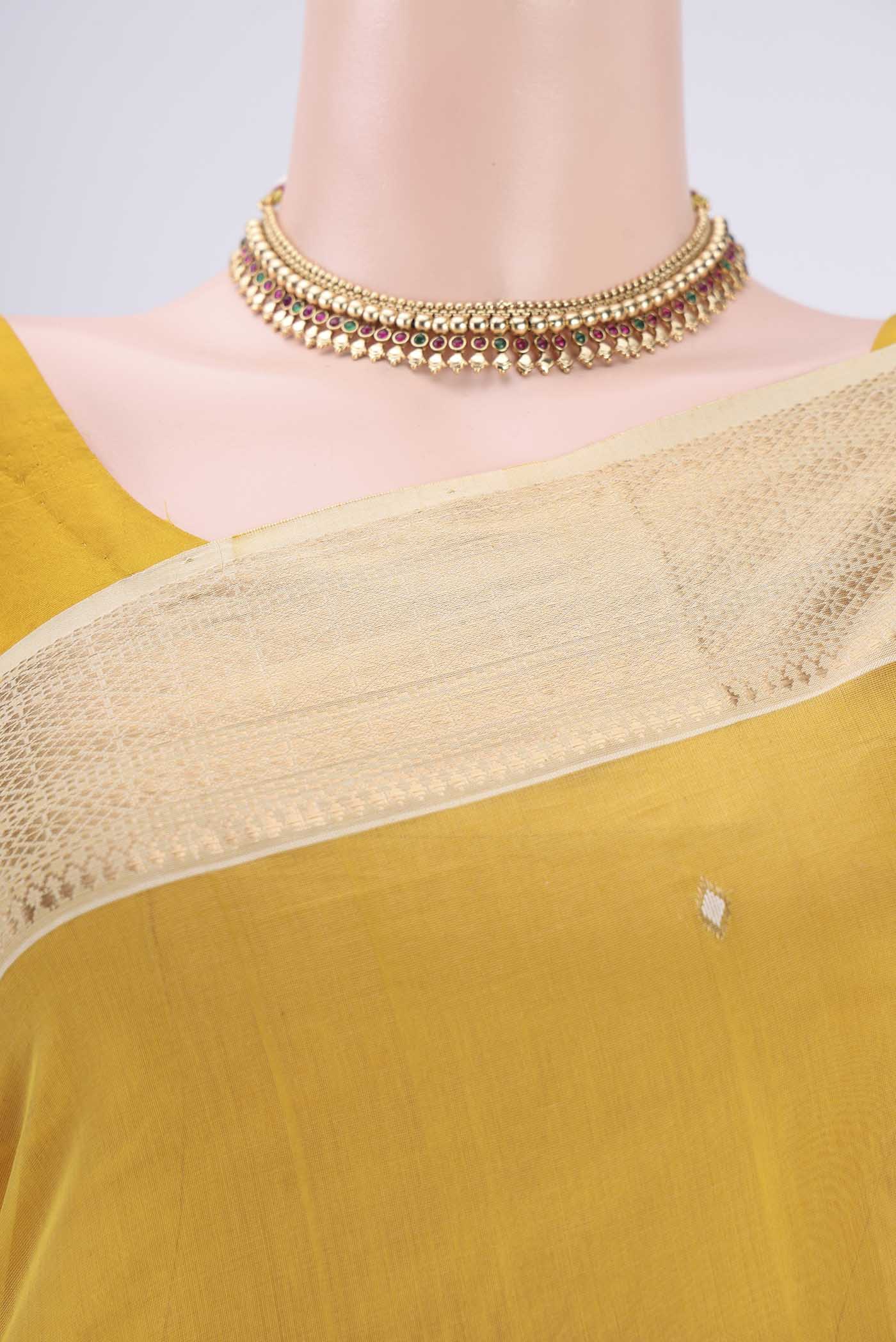 Border image of Yellow Maheshwari Silk Cotton Saree with Zari Butta on the body and Zari Border. 