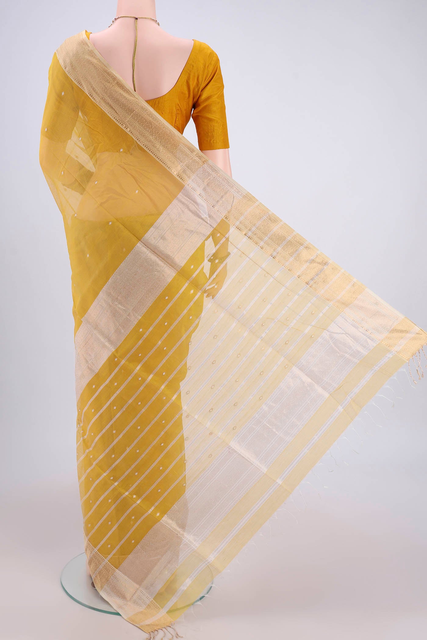 Flat view of Yellow Maheshwari Silk Cotton Saree with Zari Butta on the body and Zari Border. 