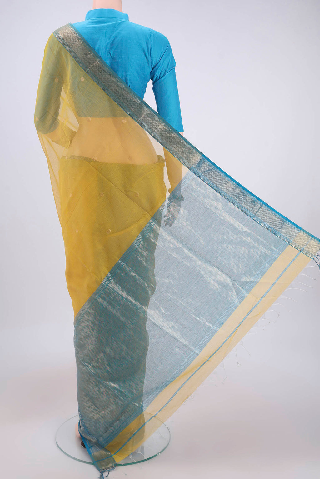 Flat view of Yellow Maheshwari Silk Cotton Saree with Zari Butta on the body and Zari Border. 
