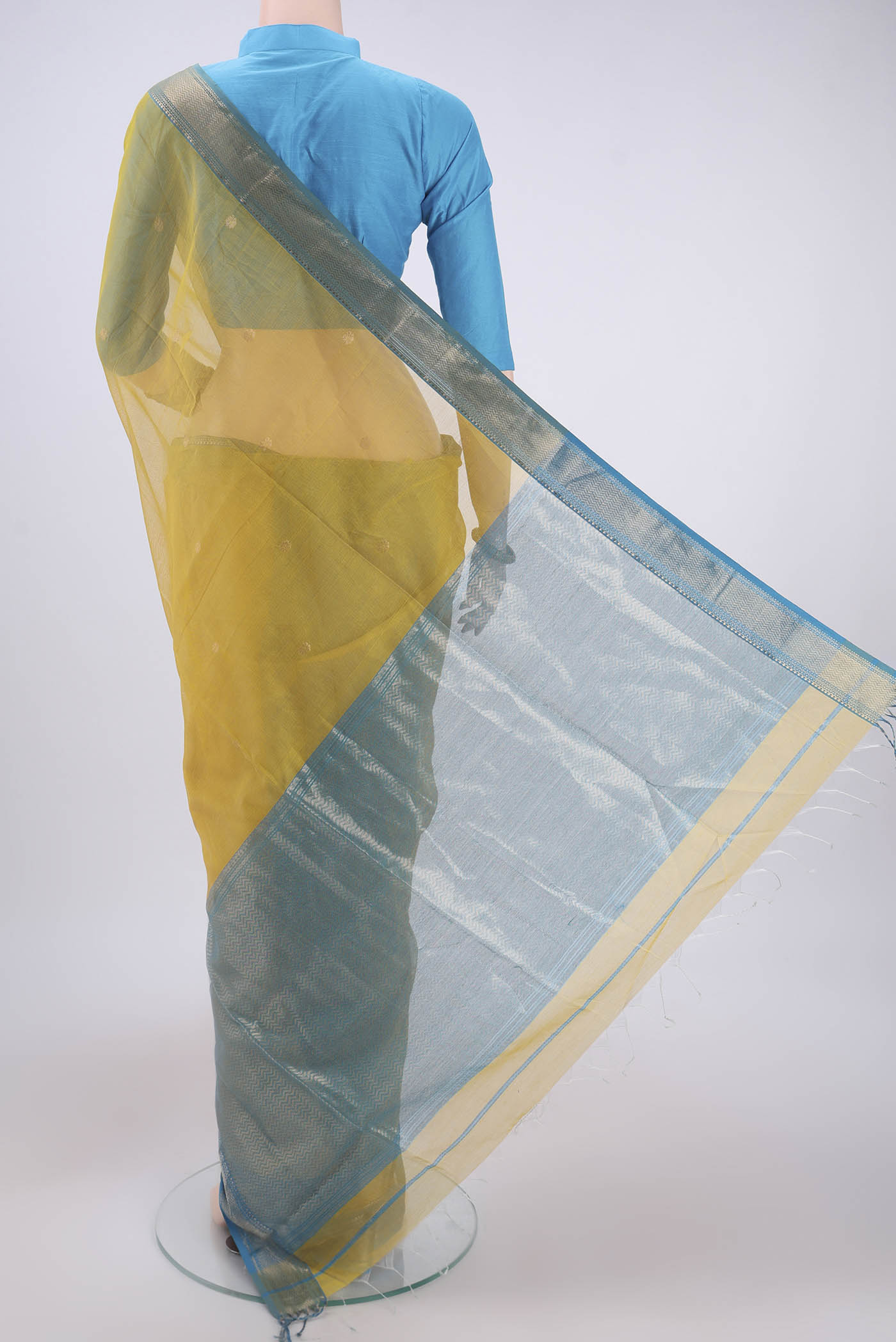Flat view of Yellow Maheshwari Silk Cotton Saree with Zari Butta on the body and Zari Border. 