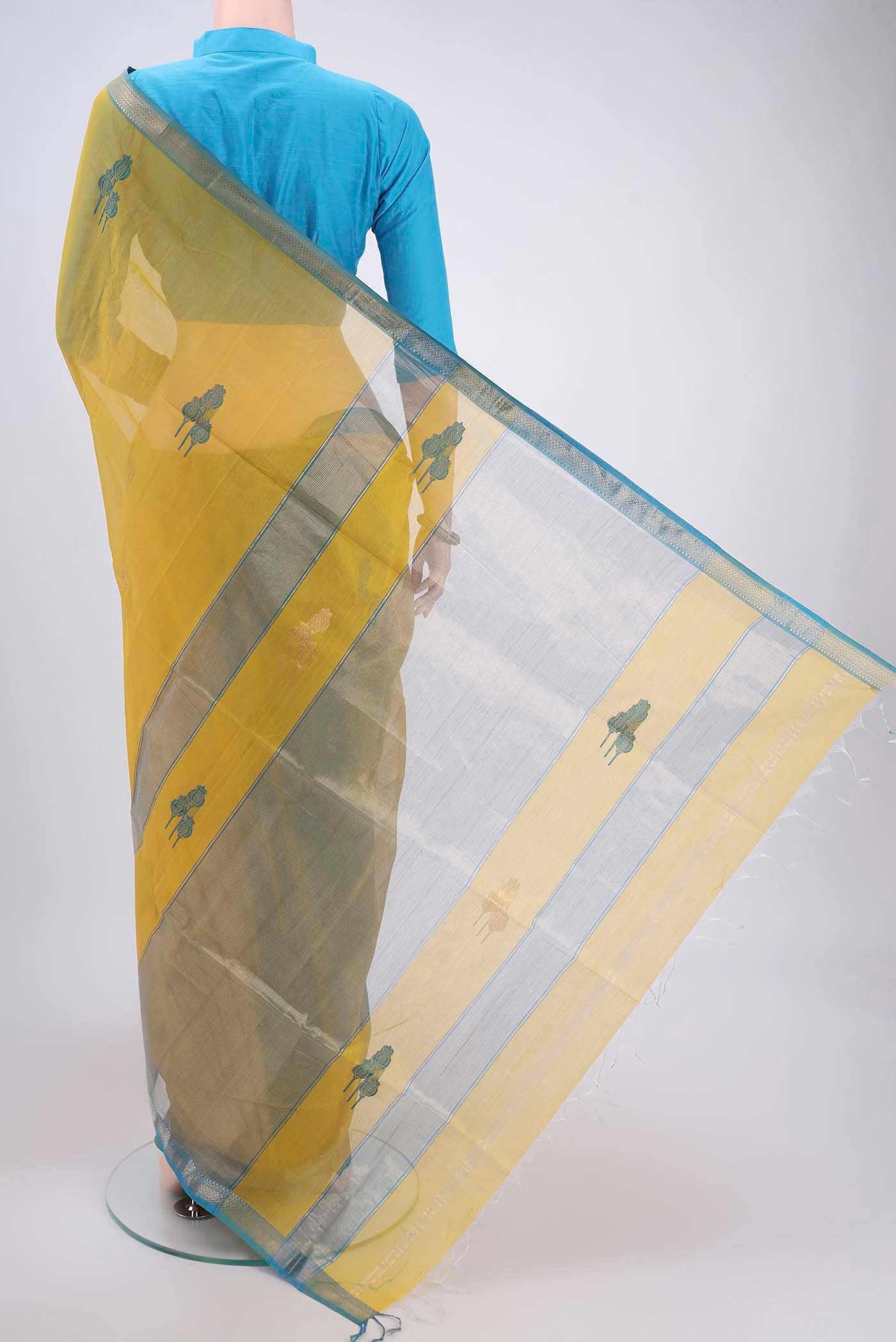 Flat view of Yellow Maheshwari Silk Cotton Saree with Zari And Thread Butta on the body and Zari Border. 