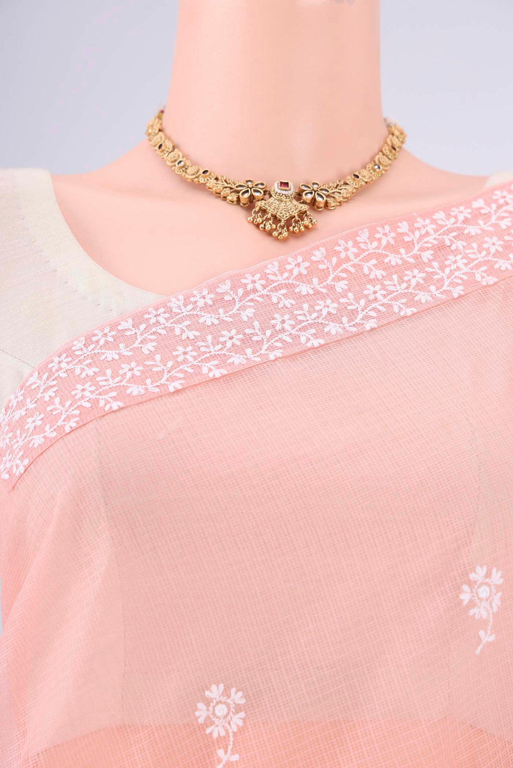 Border image of Peach Blended Kota Cotton Saree with Embroidery on the body and Checks Border. 