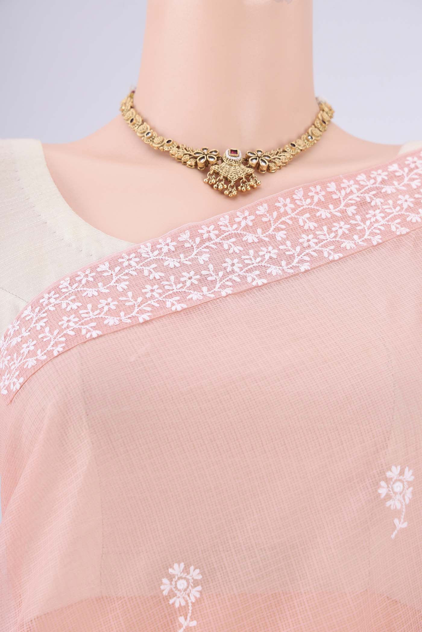 Border image of Peach Blended Kota Cotton Saree with Embroidery on the body and Checks Border. 