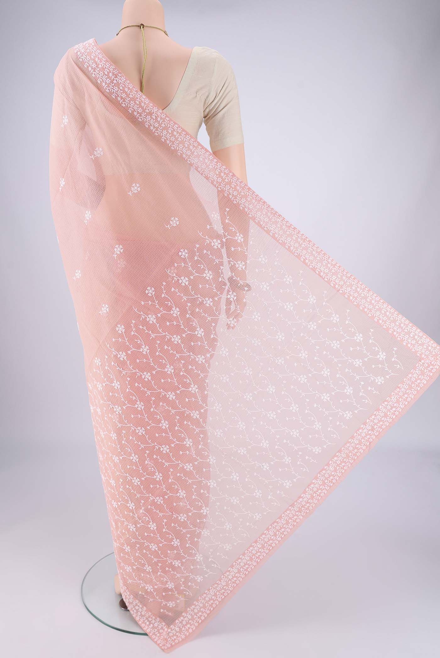 Flat view of Peach Blended Kota Cotton Saree with Embroidery on the body and Checks Border. 