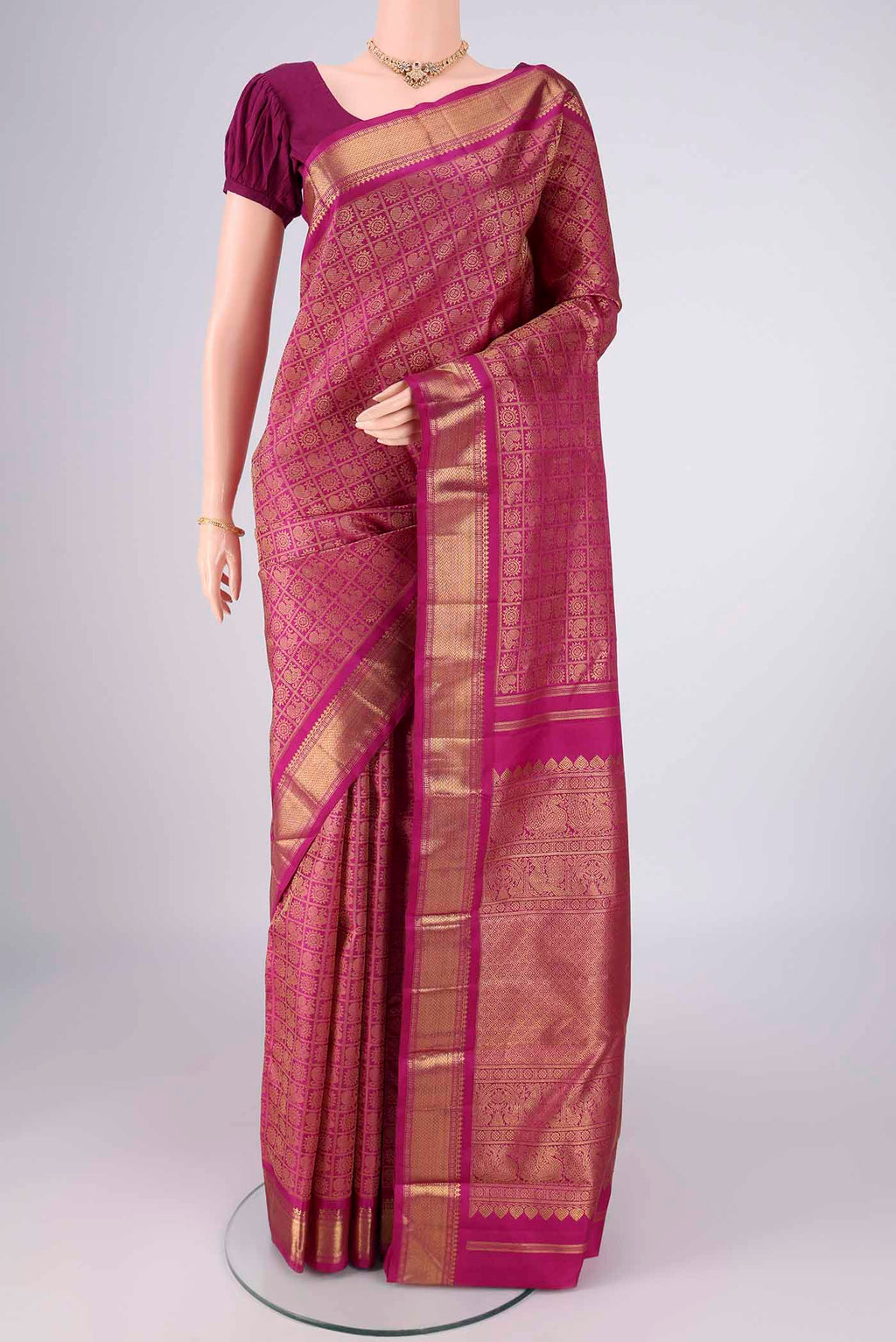 Pure Silk Pure Zari Light Magenta Kanjivaram Saree with Zari Brocade on the body and Zari Border.  displayed on a mannequin