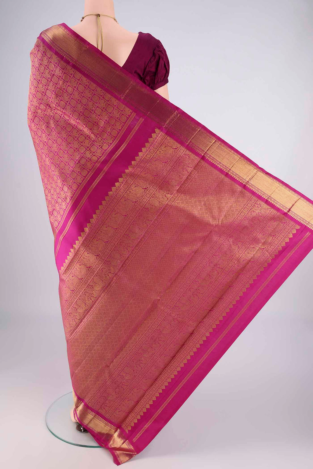 Flat view of Pure Silk Pure Zari Light Magenta Kanjivaram Saree with Zari Brocade on the body and Zari Border. 