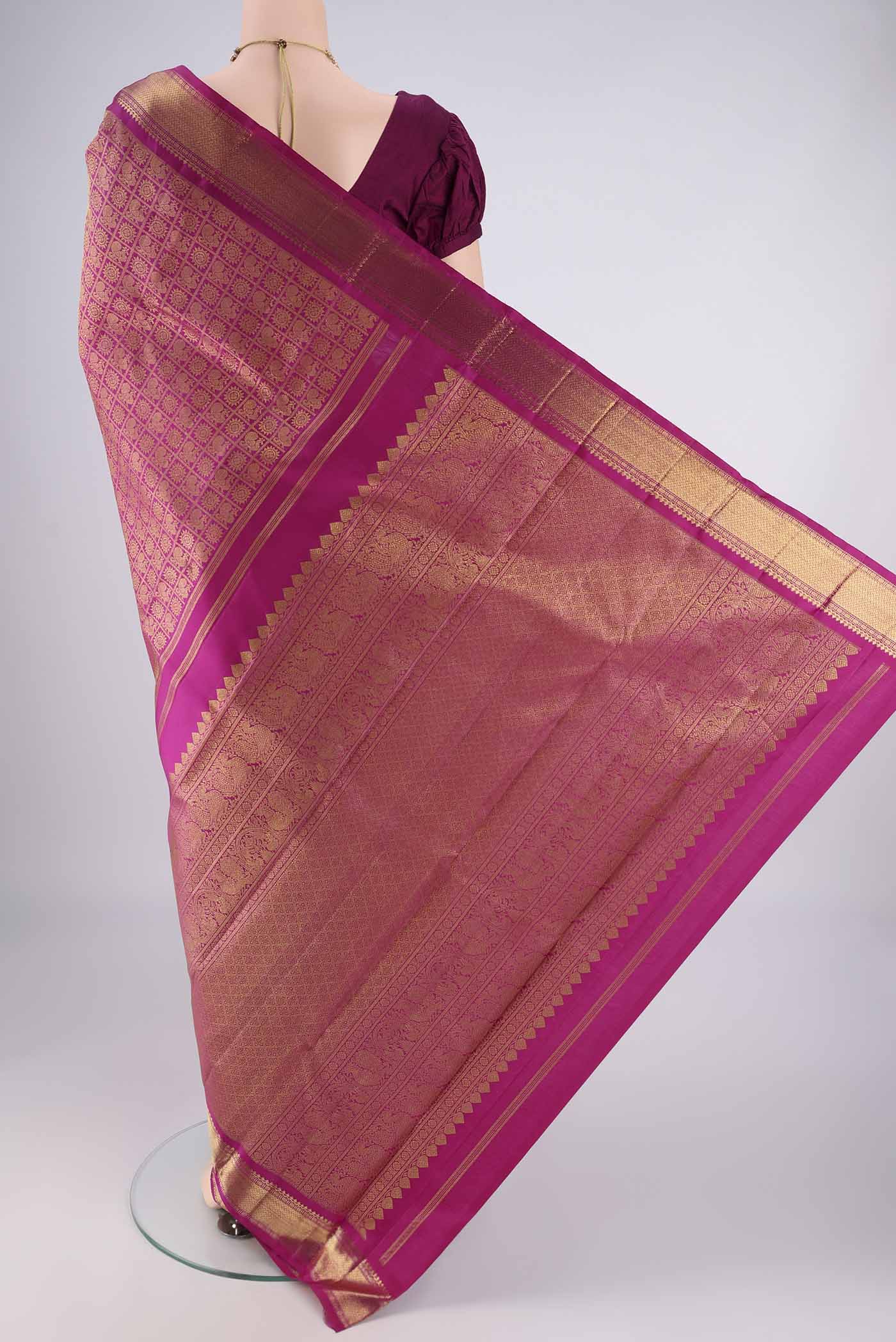 Flat view of Pure Silk Pure Zari Light Magenta Kanjivaram Saree with Zari Brocade on the body and Zari Border. 