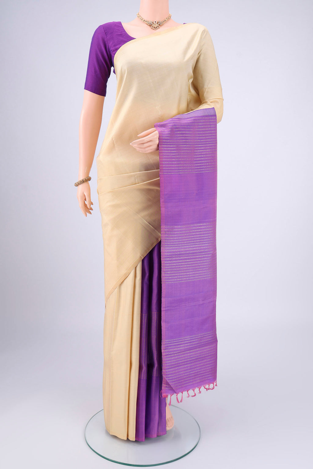 Cream Coimbatore Silk Cotton Saree with Plain Body and Plain Border.  displayed on a mannequin