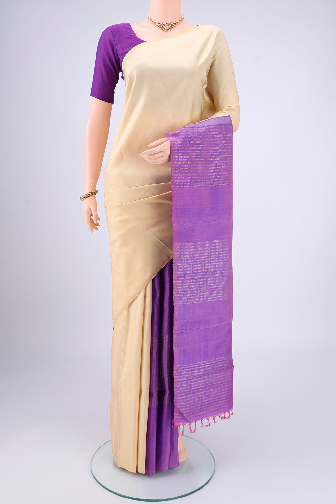 Cream Coimbatore Silk Cotton Saree with Plain Body and Plain Border.  displayed on a mannequin