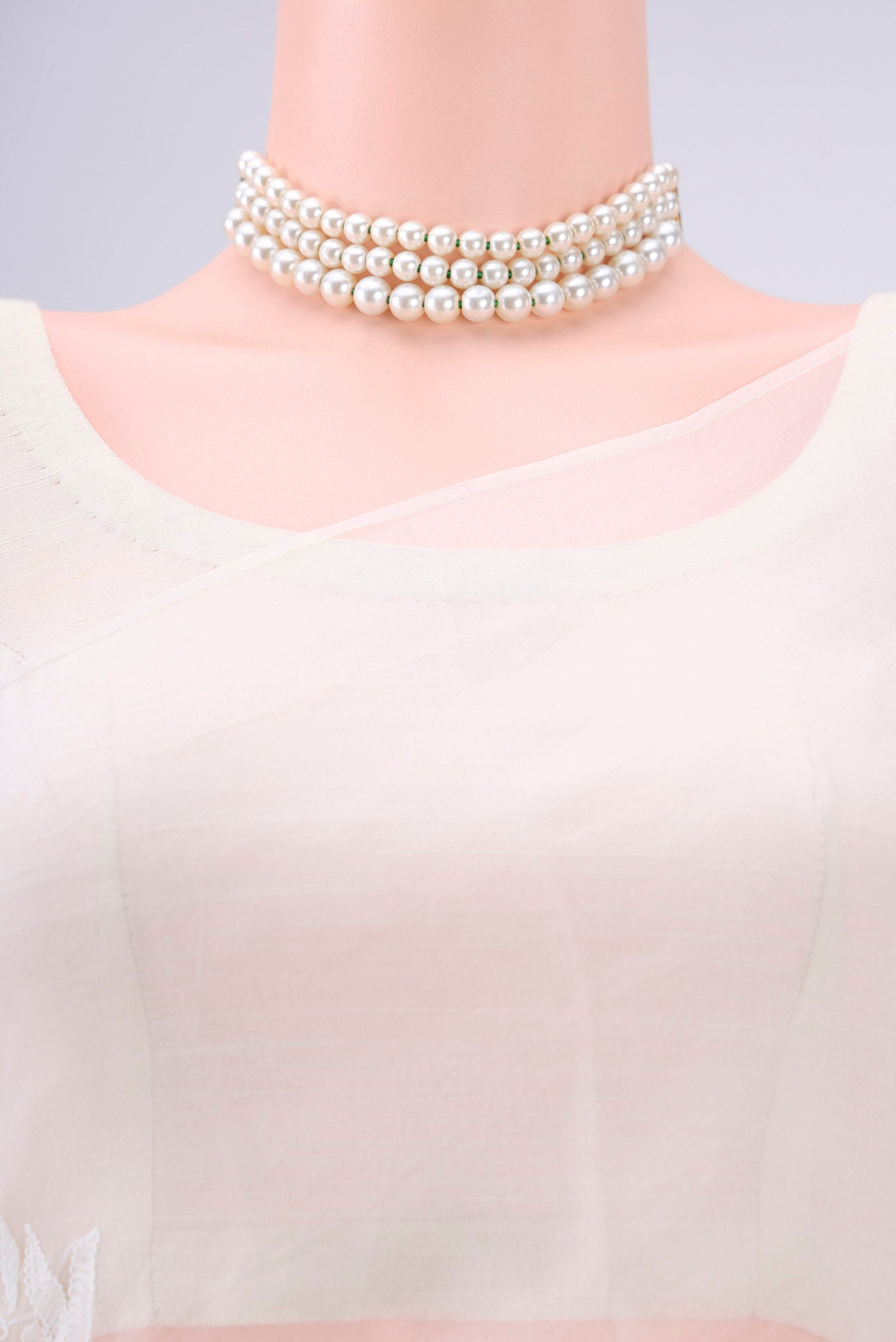 Border image of White Organza Silk Saree with Embroidery on the body and Thin Zari Line. 