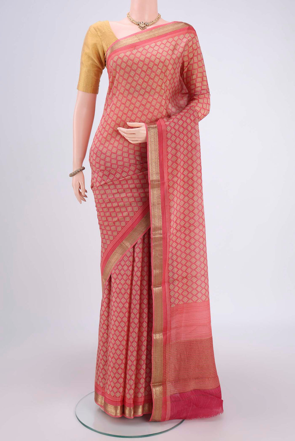 Pink Mysore Crepe Saree with Floral Print on the body and Zari Border.  displayed on a mannequin